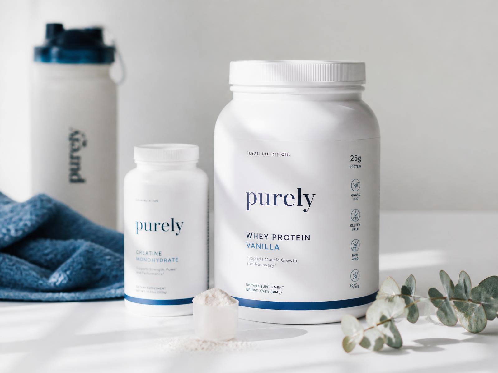 Premium supplement bottles and protein scoop on a bright white surface